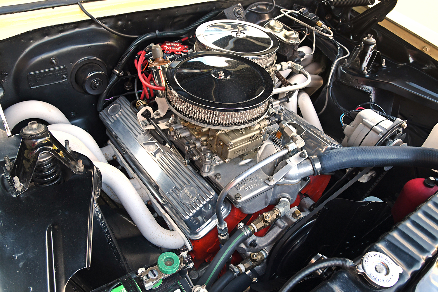007 1967 Chevrolet Nova dual carbureted engine bay featuring Edelbrock intake manifold and Holley carburetors
