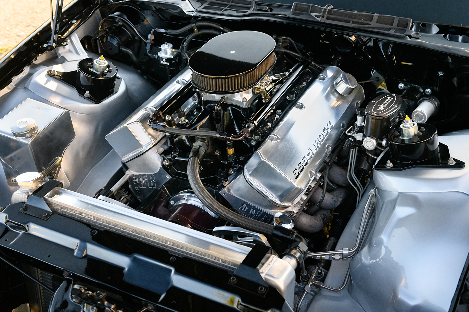 007 1986 Camaro IROC Z close up of Holley EFI throttle body and fuel system