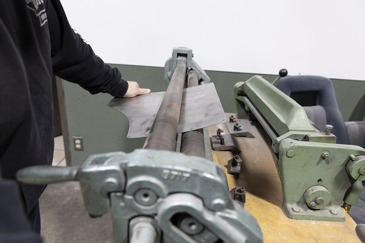 007 Metal panel is shaped on a roller machine to match the contour of the Chevelle's rear quarter panel