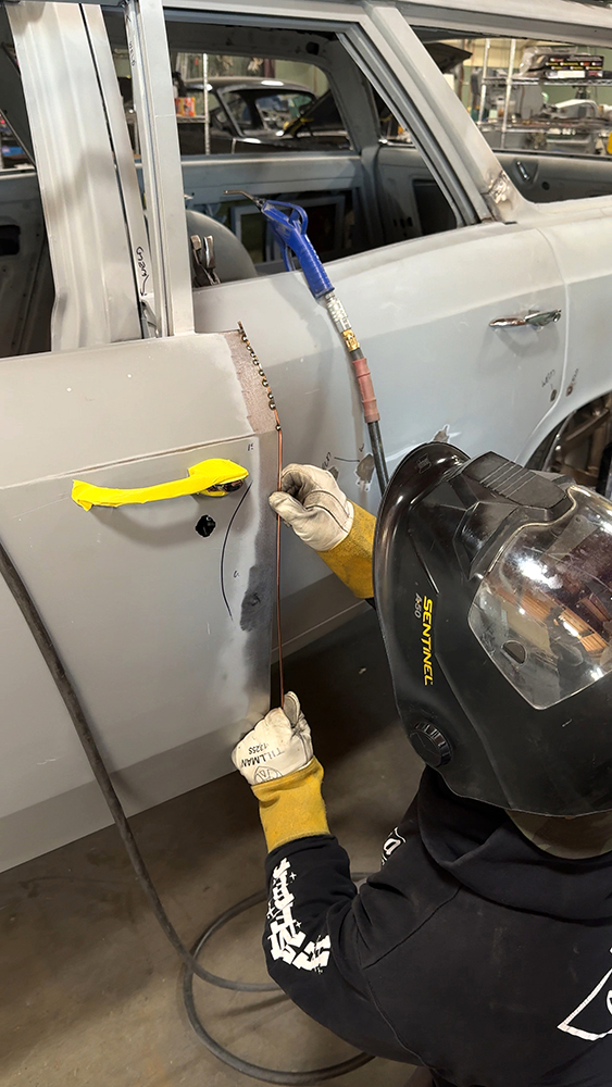 007 Series of tack welds along the door gap clamped to ensure alignment