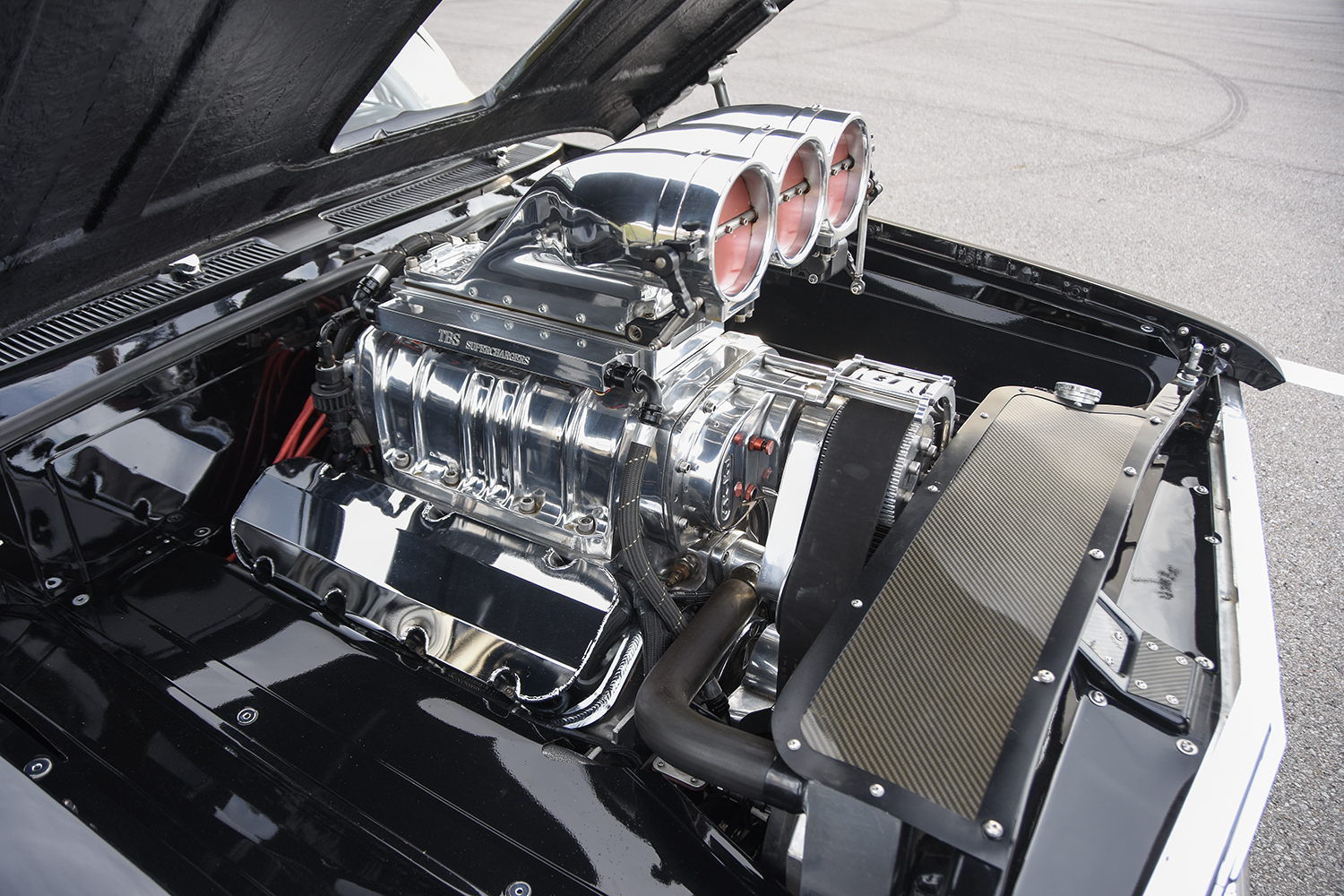 008 1961 Chevrolet Impala rear suspension with massive slick tires tucked under the fender for ultimate traction and stability