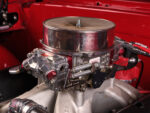 008 1965 Chevrolet Impala SS carburetor close up view of high performance intake manifold and polished components