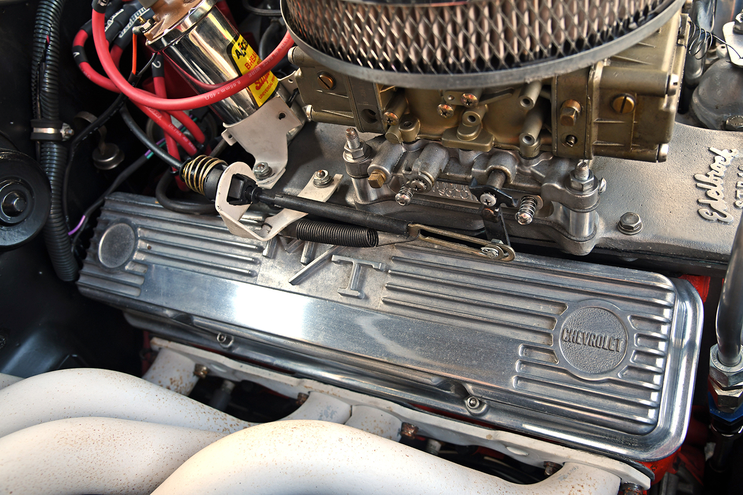 008 1967 Chevrolet Nova detailed view of Chevrolet stamped valve covers and red ignition wires for a powerful setup
