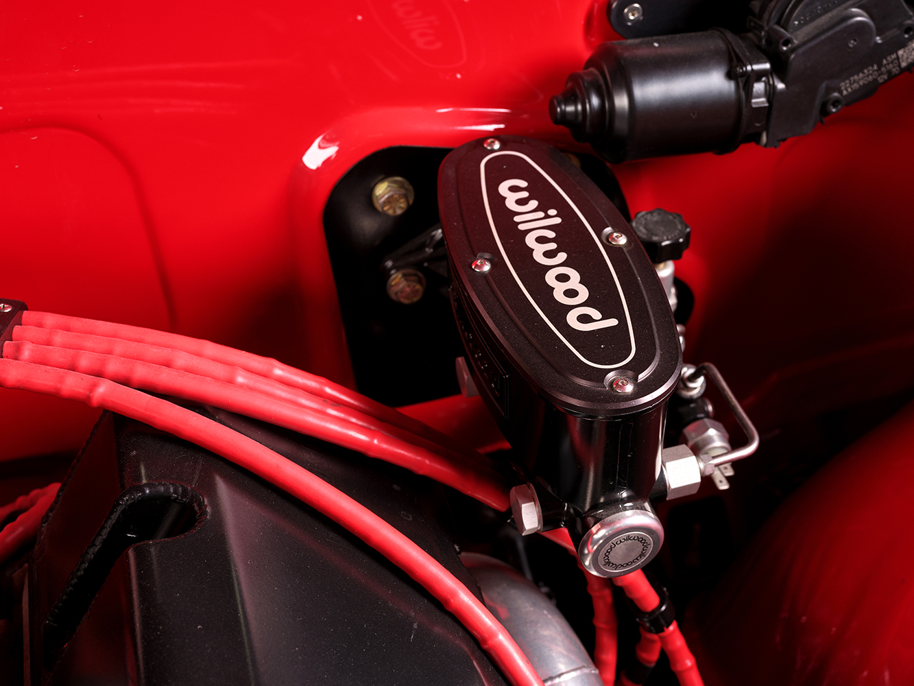 009 1965 Chevrolet Impala SS Wilwood master cylinder close up upgraded braking system and red wiring details