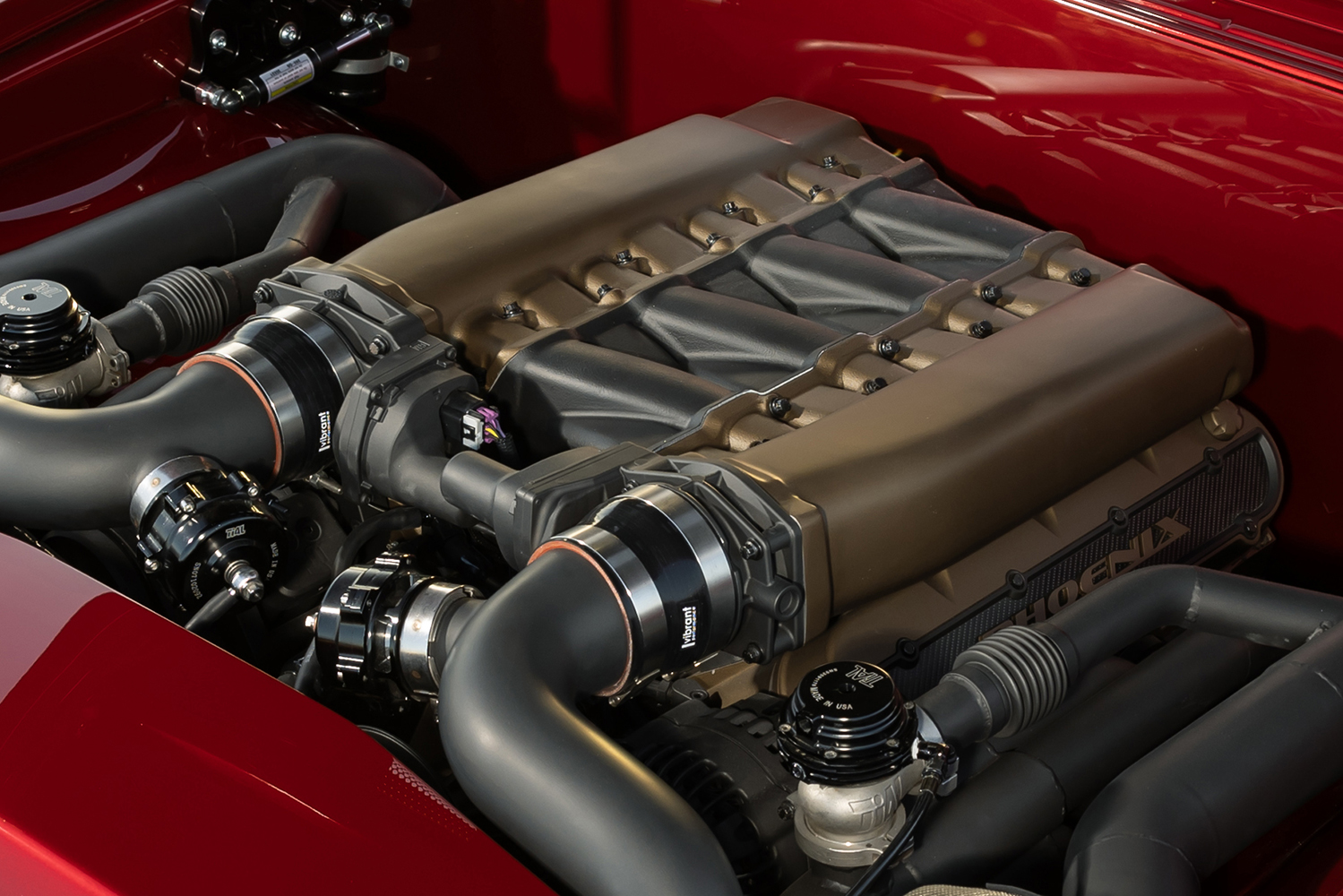 009 1966 Chevelle close up twin turbo engine high flow piping billet components