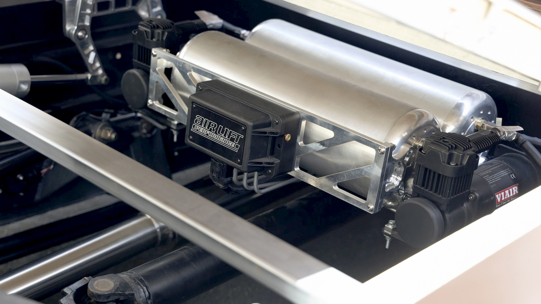 00B Air Lift Performance System Custom mounted air management with VIAIR compressors and polished tanks