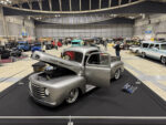 01 1949 Ford F1 – Silver with a modern stance polished wheels and a custom engine bay on display