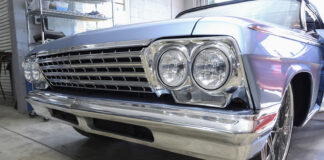 01 A restored 1962 Chevy Impala with a gleaming chrome grille and quad headlight design