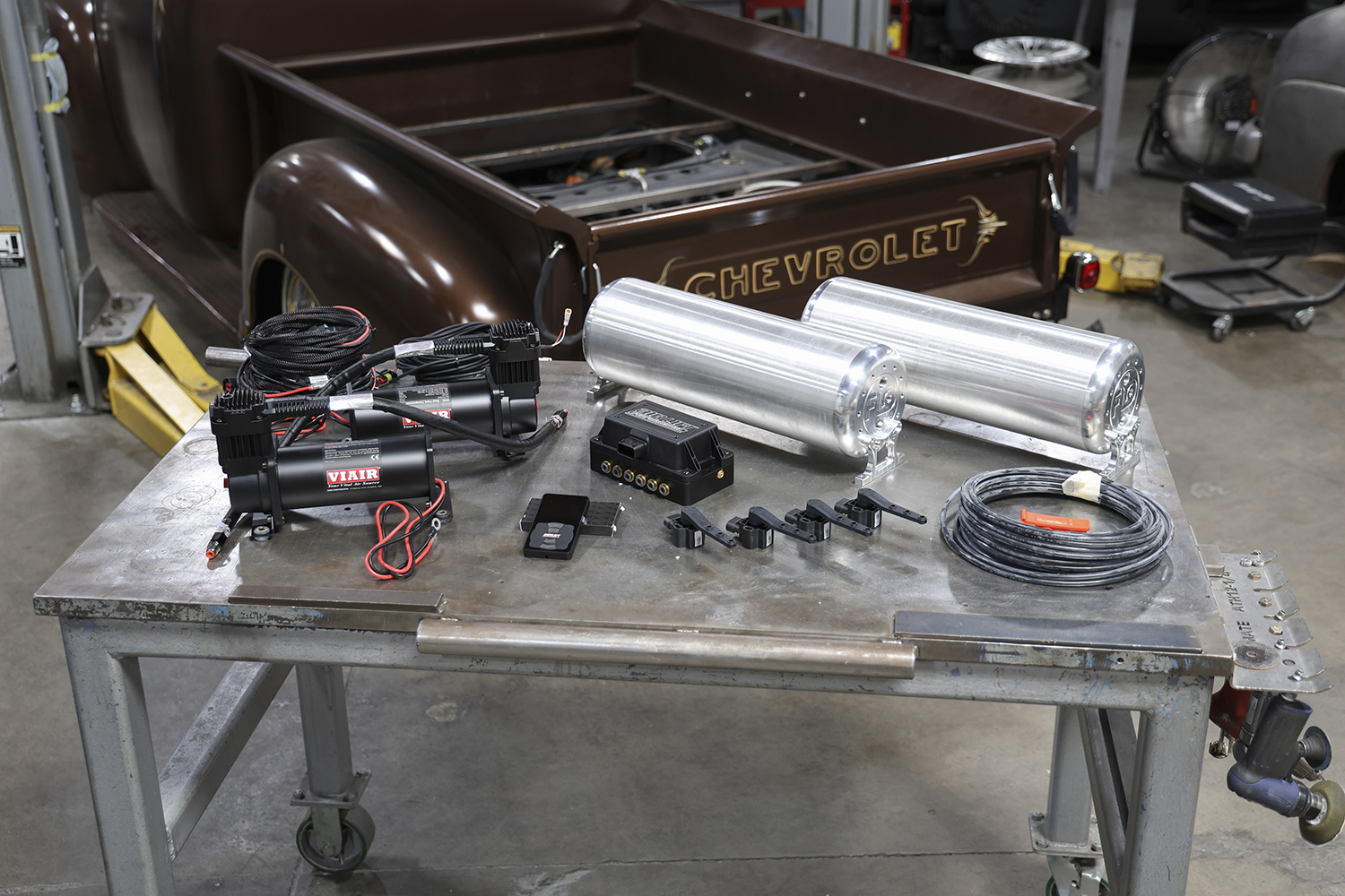 01 Air Ride Components Full Air Lift kit with compressors tanks valves and sensors laid out