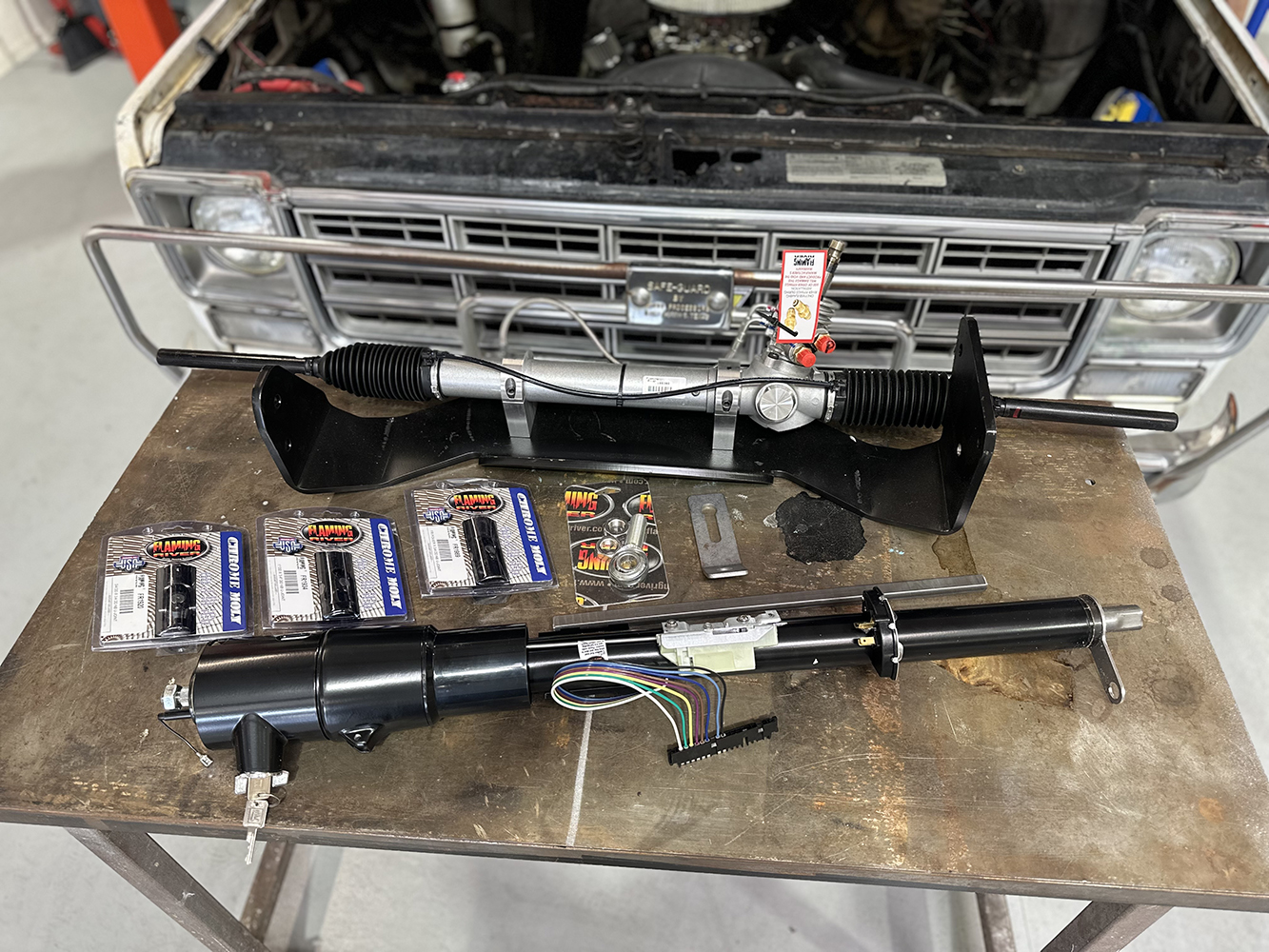 01 Flaming River tilt steering column and new rack setup laid out for installation