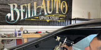 01 Upholstery shop worker spraying adhesive for a 1970 Chevy Nova headliner installation