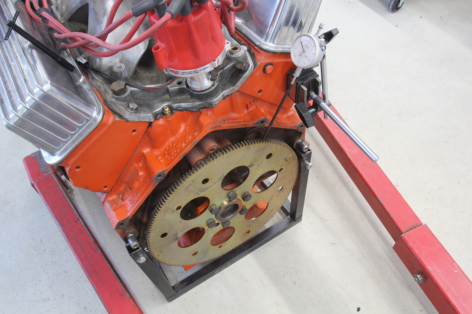 09 Shim being inserted for alignment between the starter and the bellhousing