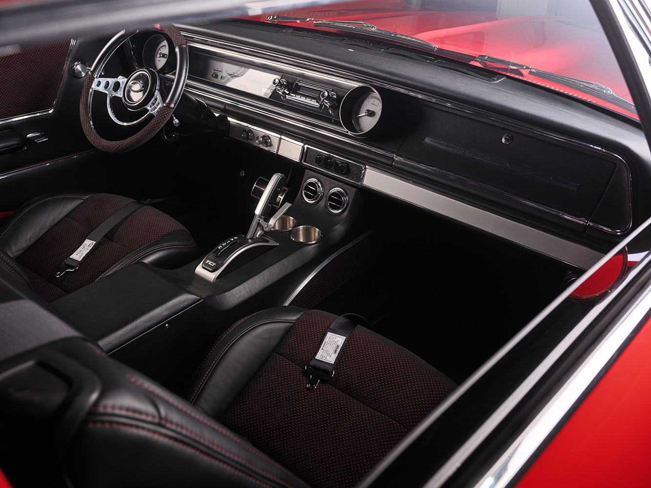 011 1965 Chevrolet Impala SS custom interior black leather seats with red stitching modern console and updated trim