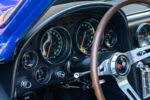 011 1966 Chevrolet Corvette close up of instrument cluster featuring vintage speedometer tachometer and classic gauge layout