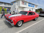 011 1971 Chevrolet Nova drag car in red with silver stripes and a supercharged big block