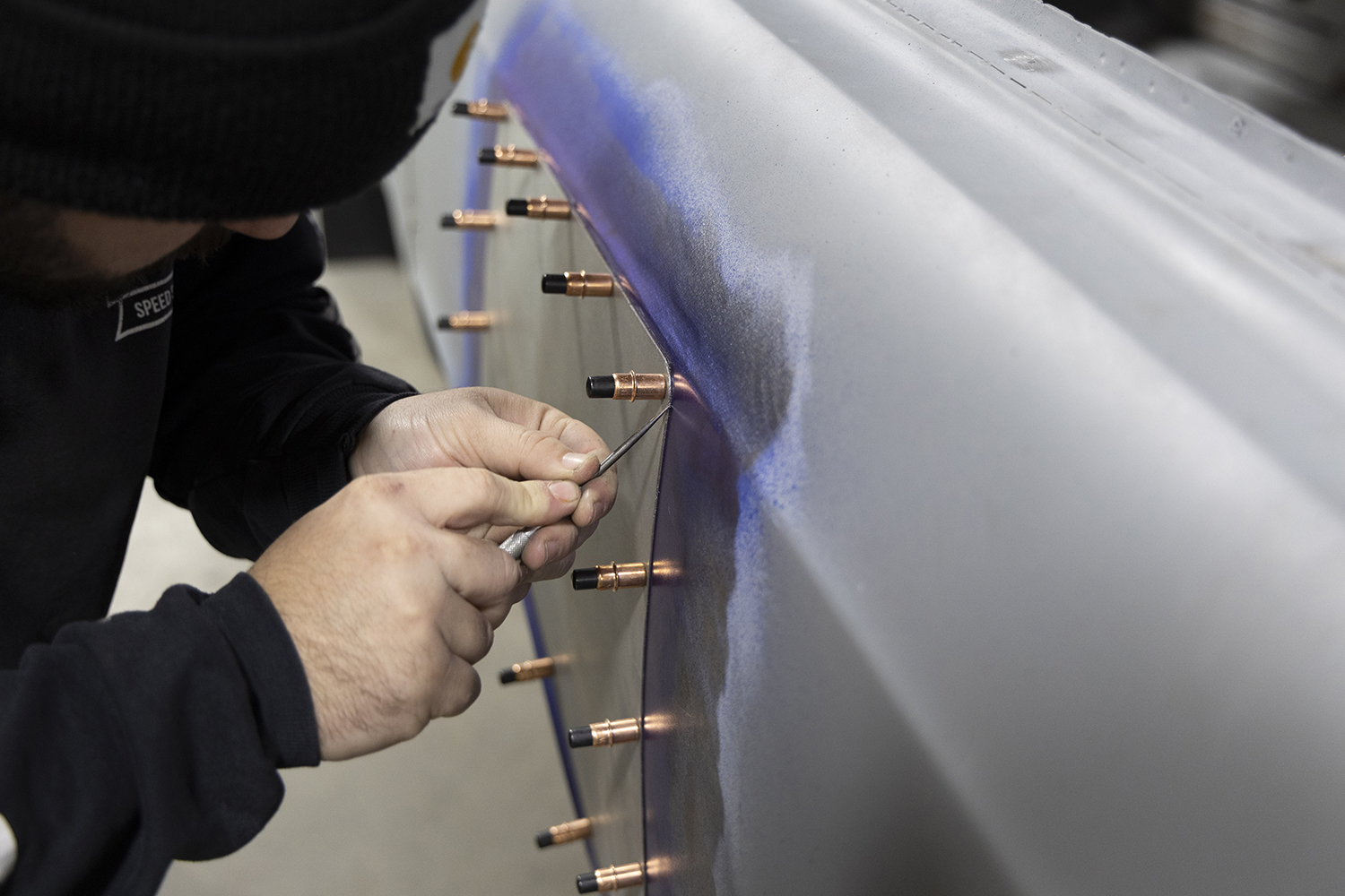 011 Fabricator precisely aligns the patch panel using Cleco fasteners before final welding on the 1966 Chevelle wagon