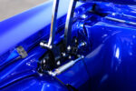 012 1969 Chevrolet Camaro custom hood hinge assembly with polished components enhancing the engine bay aesthetics