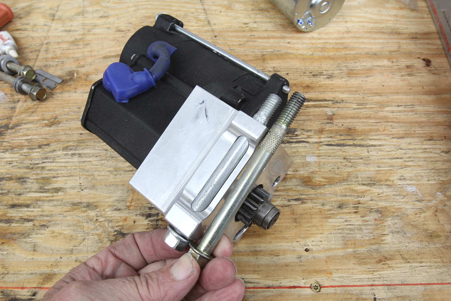 012 Modern starter motor assembly displayed with mounting bolts for secure installation