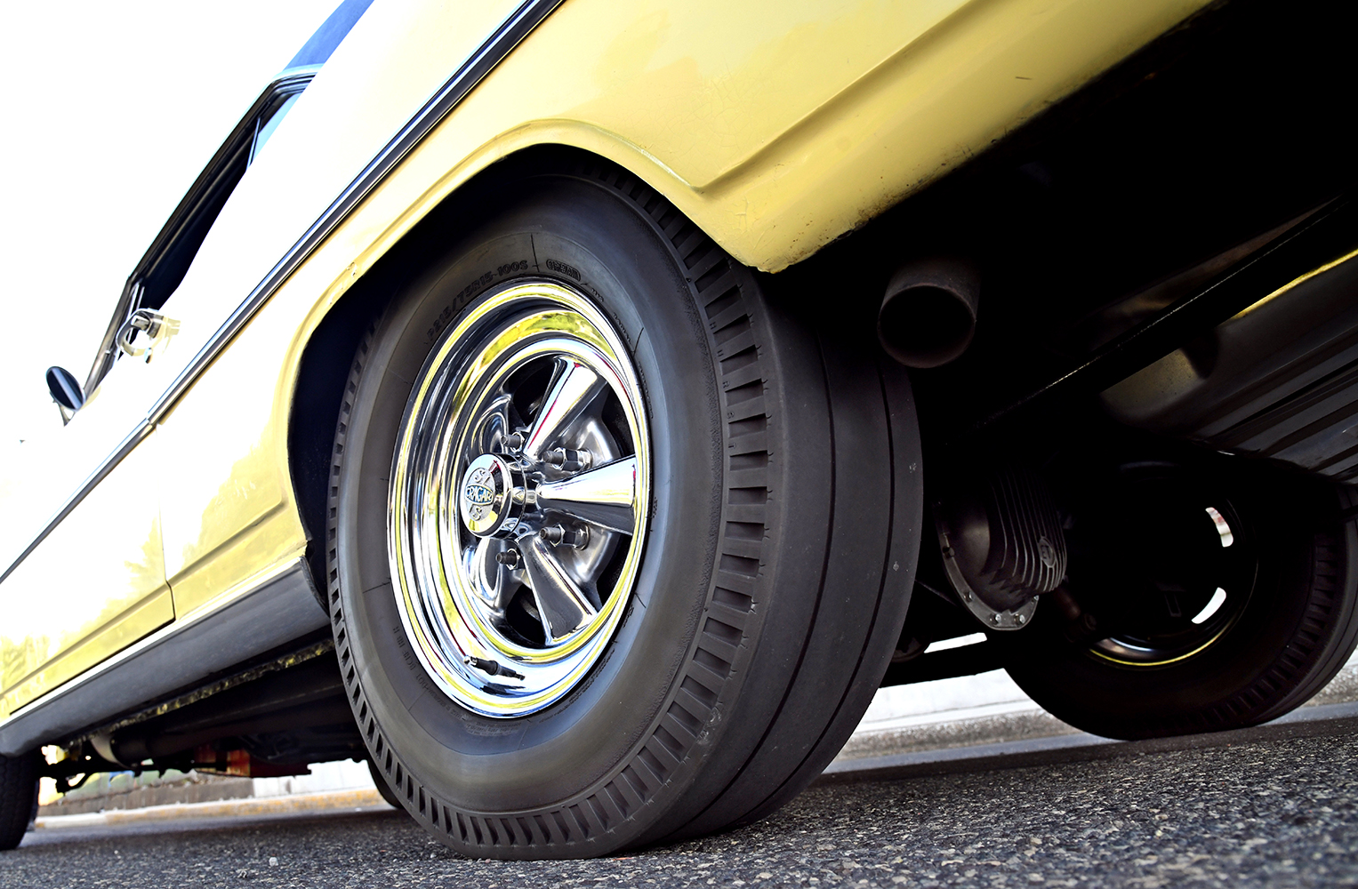 013 1967 Chevrolet Nova SS chrome Cragar wheels with radial tires showcasing its classic stance and restoration