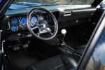 013 1969 Chevrolet Camaro interior with modern gauges custom steering wheel and a classic white Hurst shifter
