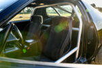 013 1986 Camaro IROC Z interior with race ready roll cage and reinforced safety structure
