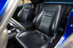 014 1969 Chevrolet Camaro black leather bucket seats with blue stitching blending comfort and style