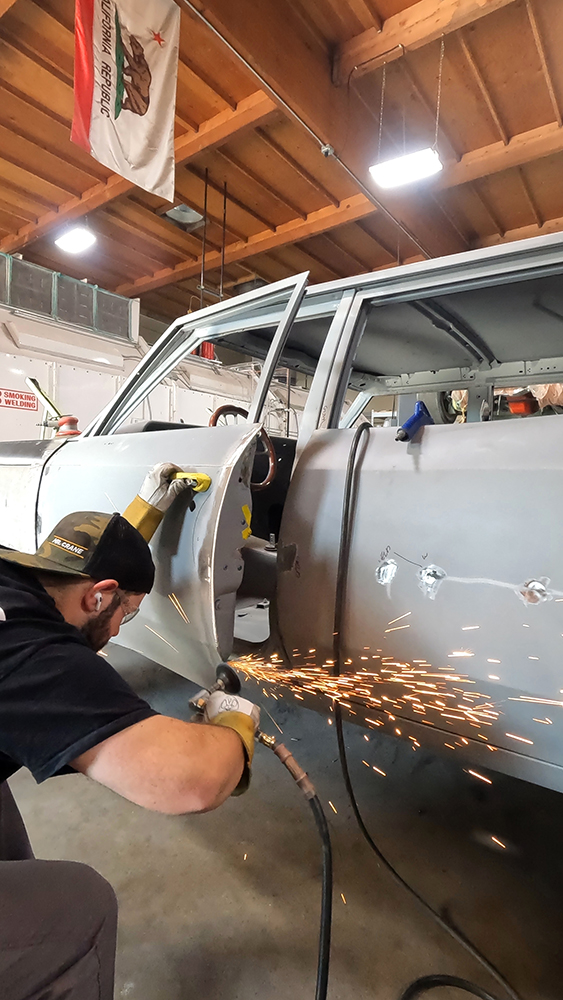 014 Technician grinding and refining door welds on the Chevelle