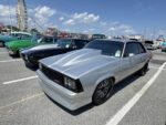 015 1980 Chevrolet Malibu Pro Street build in silver with a fiberglass cowl hood and blacked out trim