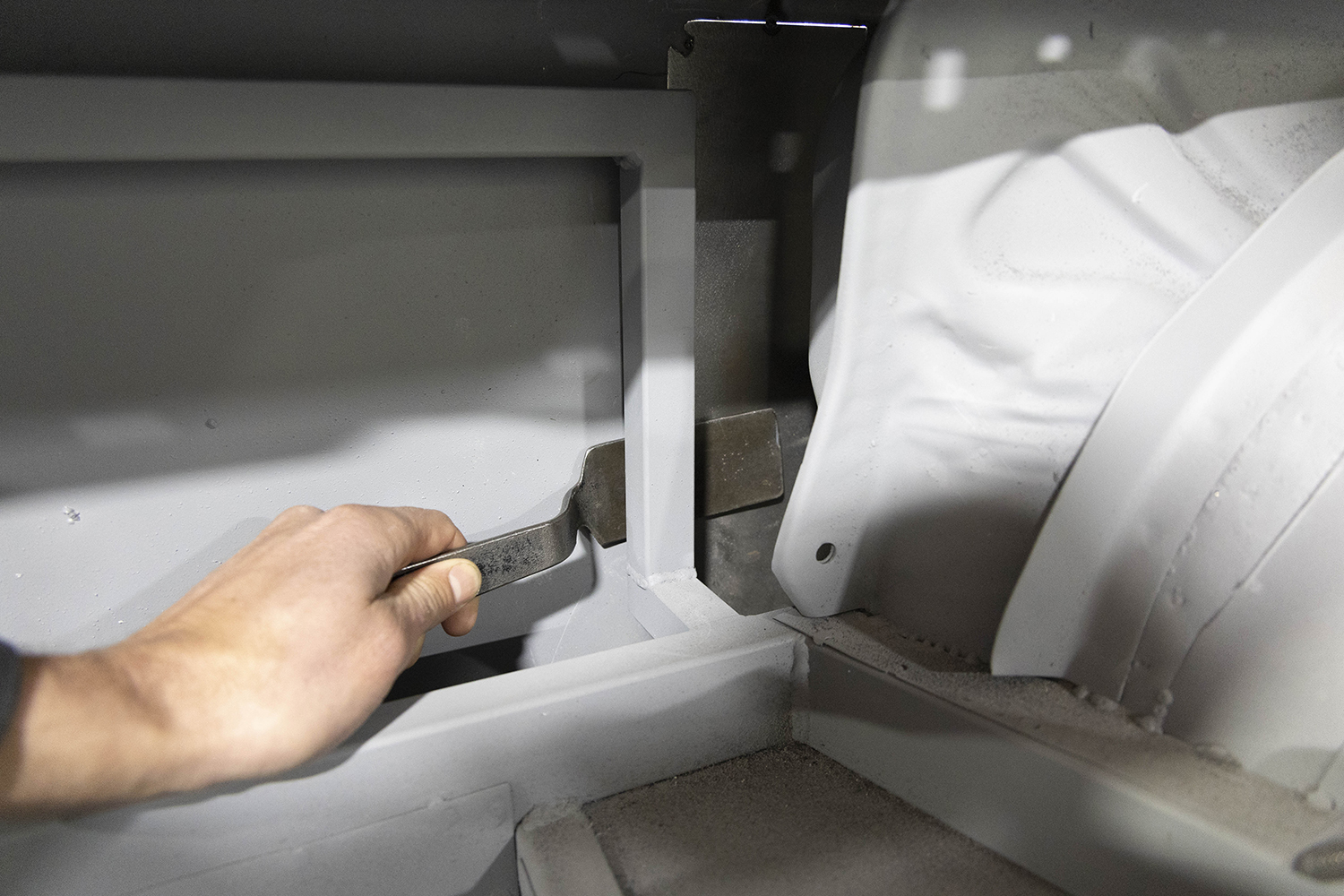 016 Interior bracing is adjusted to support the newly installed patch panel for structural integrity