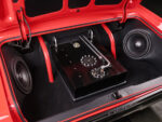 017 1965 Chevrolet Impala SS trunk with custom fuel cell subwoofer system and red roll cage supports