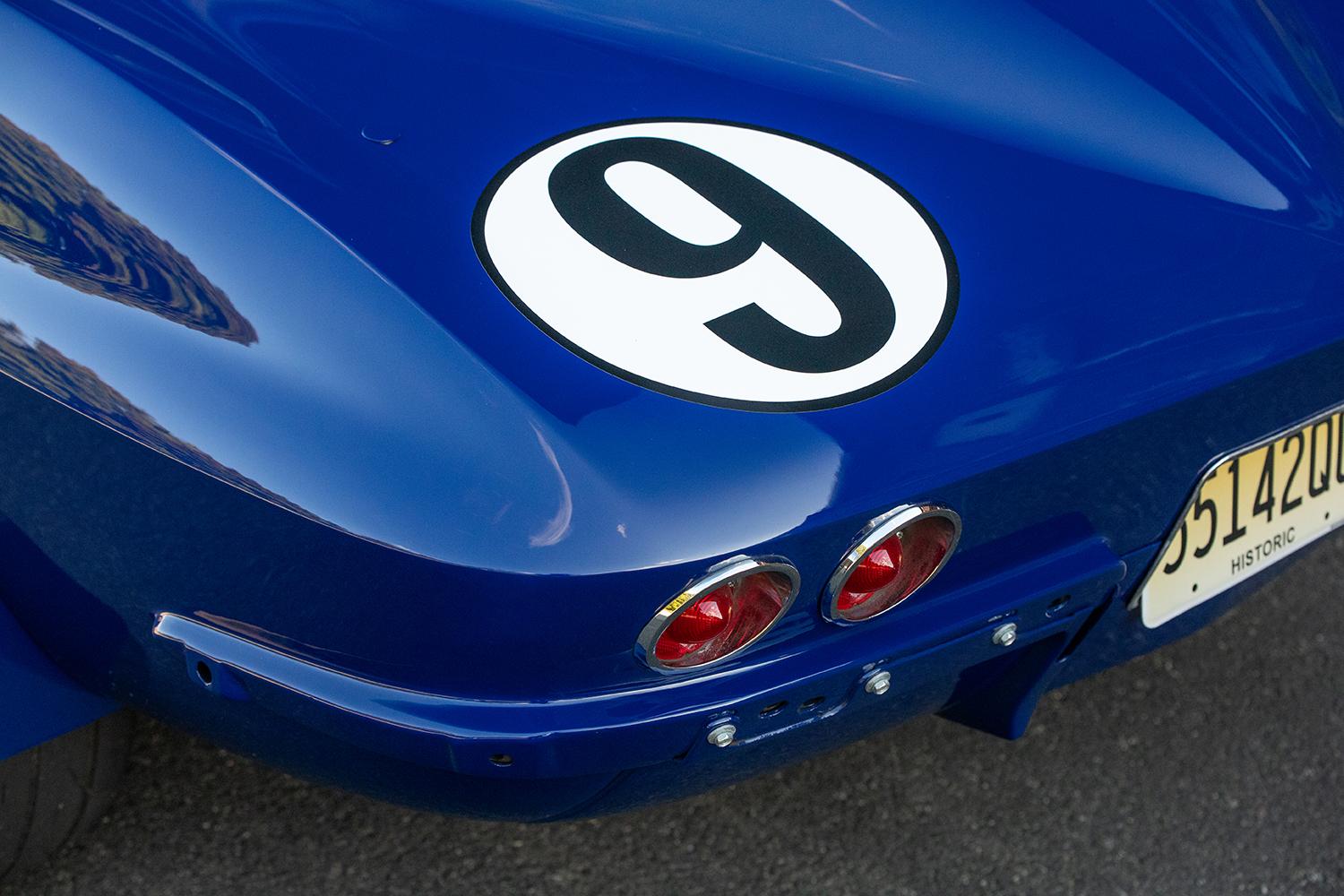 017 1966 Chevrolet Corvette rear view featuring racing number triple taillights and historic license plate