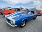 017 1968 Chevrolet Camaro SS drag car in blue with white stripes and a massive cowl hood