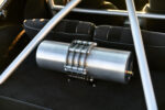 017 1986 Camaro IROC Z rear compartment features a polished air tank with custom mounting brackets