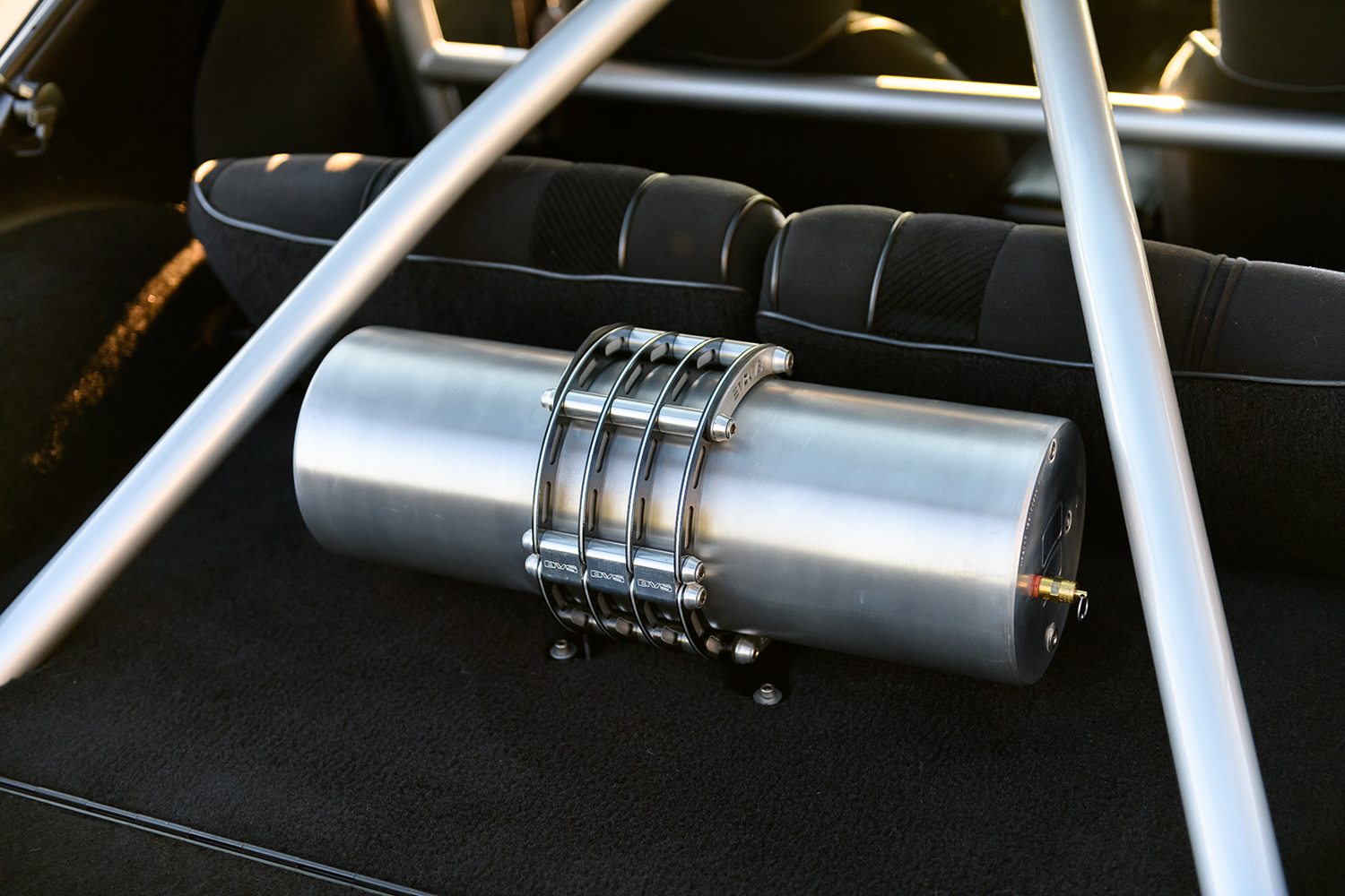 017 1986 Camaro IROC Z rear compartment features a polished air tank with custom mounting brackets