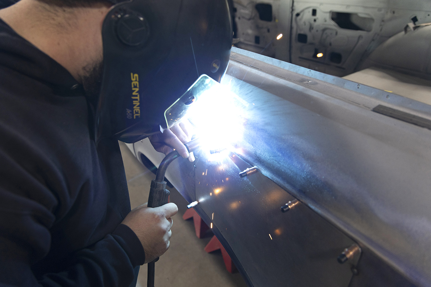 017 MIG welder fuses the new panel to the quarter panel ensuring a strong factory like finish