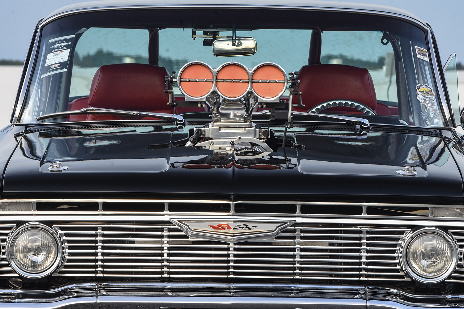 018 1961 Chevrolet Impala front view showcasing a massive supercharger scoop and aggressive stance