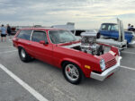 018 1975 Chevrolet Vega panel wagon in red with polished blower and tubbed rear