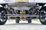 018 Polished suspension and Milodon oil pan visible under a 1966 Chevy Nova for show quality and high performance capability