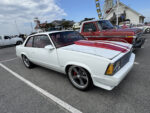 019 1979 Chevrolet Malibu SS in white with red stripes and modern five spoke wheels