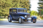 02 1932 Ford Tudor front three quarter view highlighting the grille headlights and exposed suspension