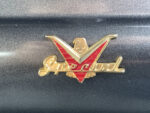 02 1957 Ford Custom emblem displaying Special in gold script with a red V and eagle accent