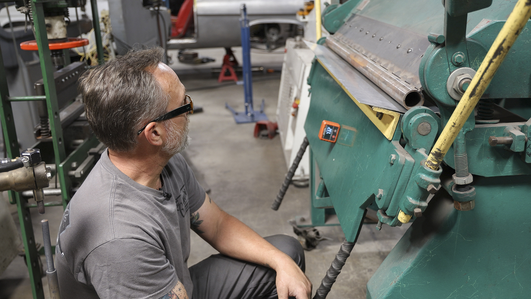 02 A craftsman working on metal fabrication for a 1962 Chevy Impala restoration