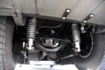 023 1961 Chevrolet Impala rear suspension featuring adjustable coilovers heavy duty rear axle and custom four link setup