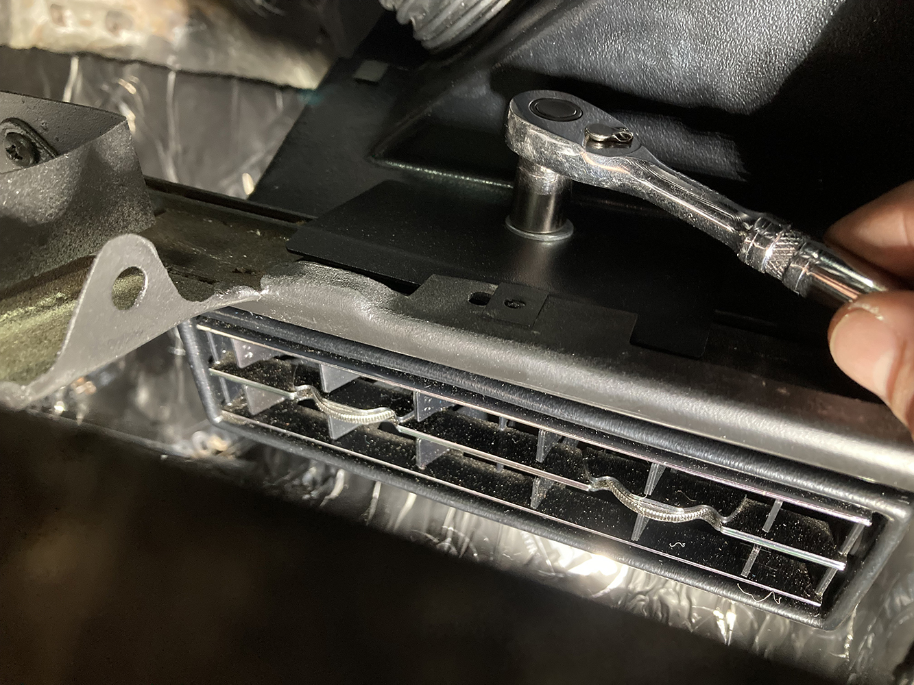 024 Securing the lower AC vent with a ratchet under the dash