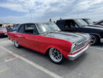 025 1963 Chevrolet Nova Pro Street in red and black with deep dish wheels and lowered stance