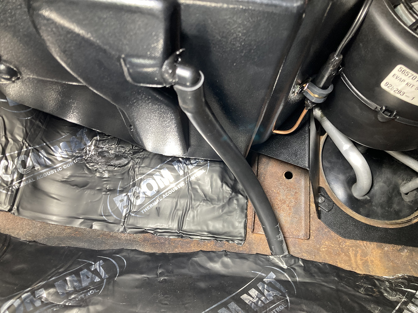 025 Drain hose routed from the evaporator housing to the floor