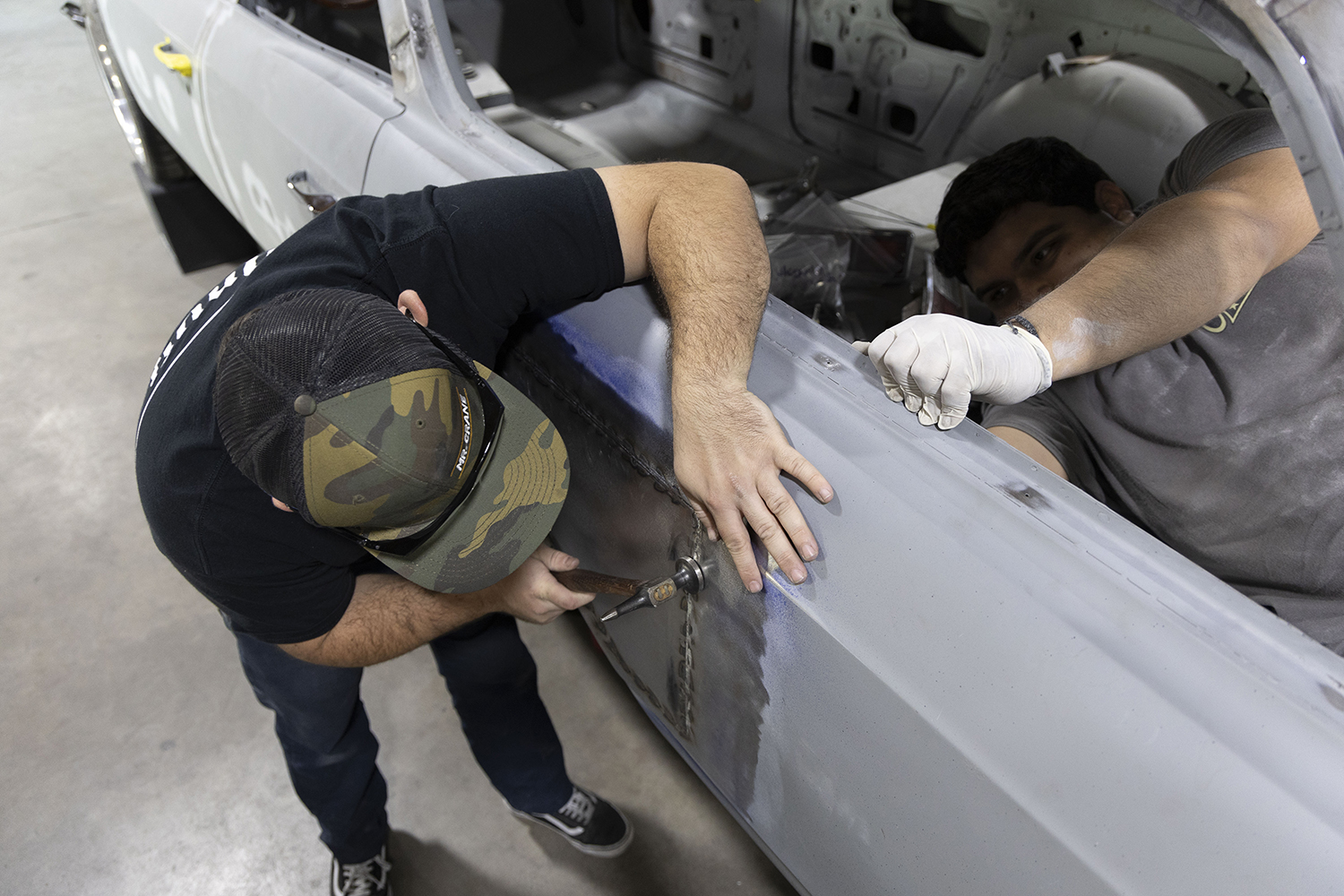 026 Panel hammer and dolly fine tune the welded area ensuring a flawless transition to the original body lines