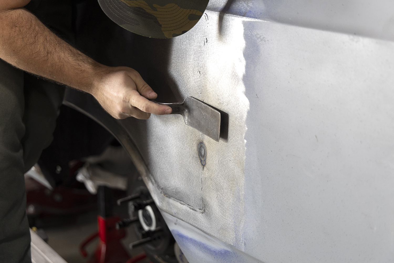 028 Pneumatic sander smooths the surface blending the repair seamlessly into the quarter panel