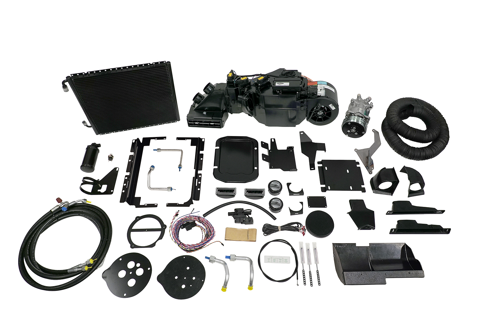03 Complete Vintage Air AC kit laid out including a black evaporator unit compressor condenser hoses and mounting brackets