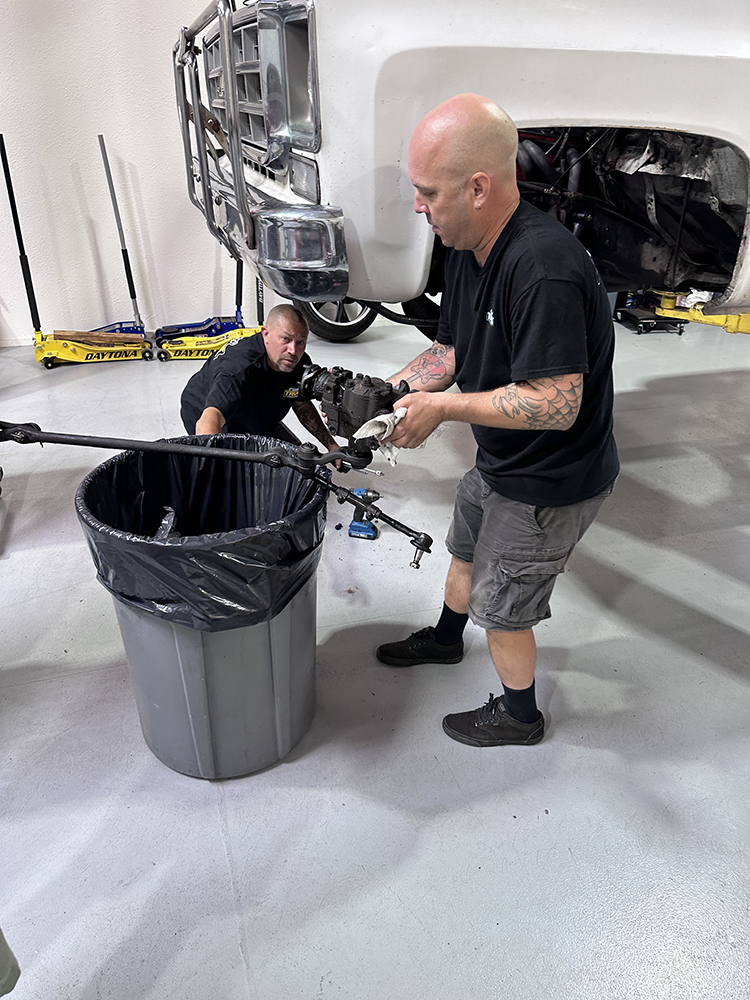 03 Mechanics removing the old steering box during a rack and pinion conversion
